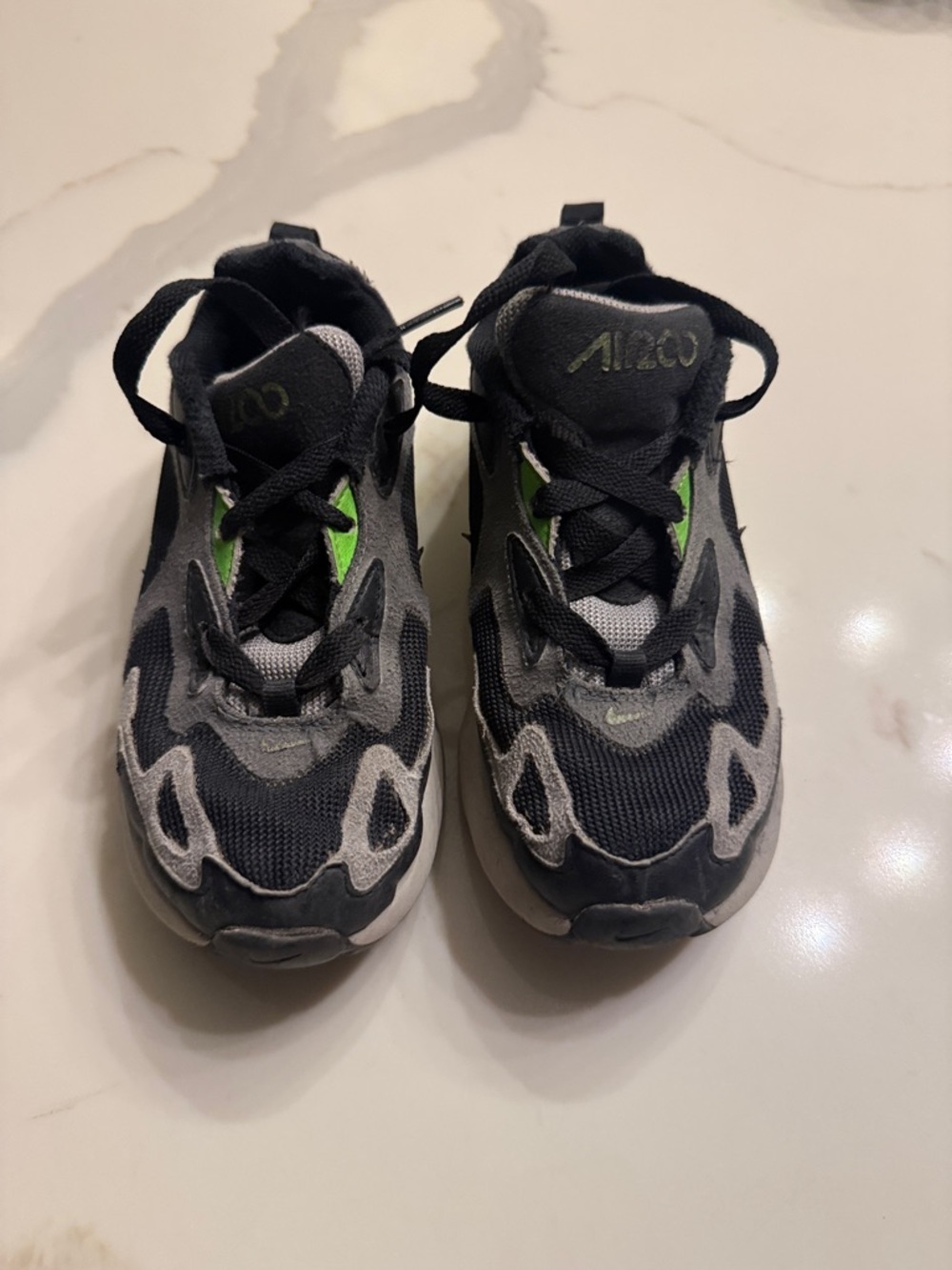 Nike Kids Black and Gray Athletic Sneakers with Green Accent